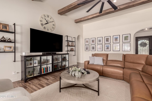 3990 E Iris Dr, Chandler, AZ 85286 - living room with arched walkways, ceiling fan, wood finished floors, and beamed ceiling