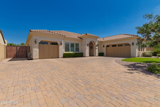 3990 E Iris Dr, Chandler, AZ 85286 - mediterranean / spanish-style home featuring an attached garage, stucco siding, and a tiled roof