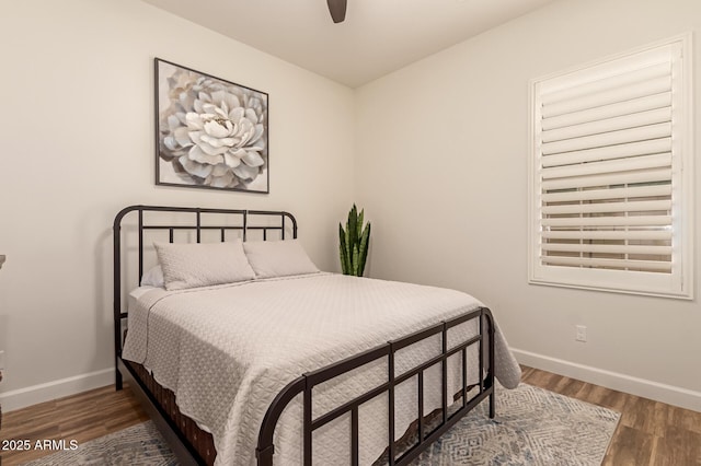 3990 E Iris Dr, Chandler, AZ 85286 - bedroom featuring baseboards, wood finished floors, and a ceiling fan