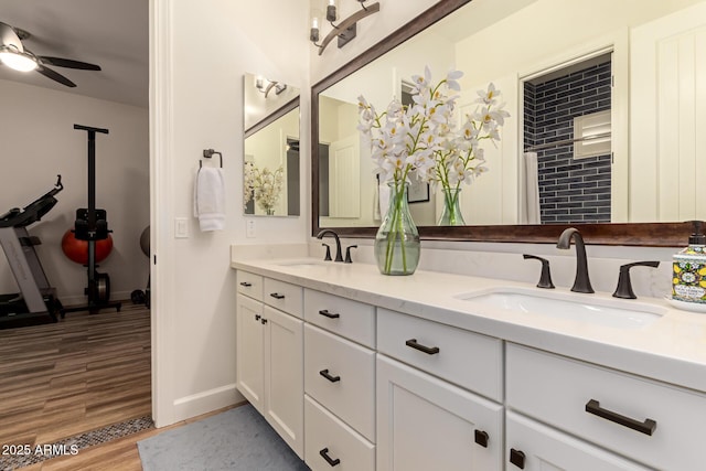 3990 E Iris Dr, Chandler, AZ 85286 - full bathroom with double vanity, wood finished floors, ceiling fan, and baseboards