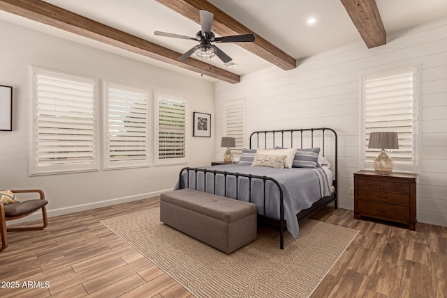3990 E Iris Dr, Chandler, AZ 85286 - bedroom featuring wood finished floors, beamed ceiling, ceiling fan, wooden walls, and recessed lighting