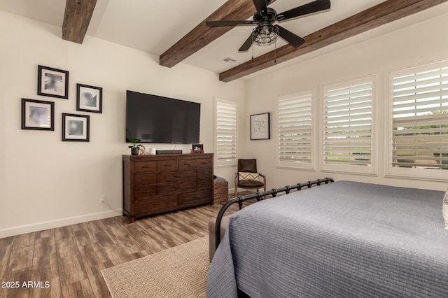 3990 E Iris Dr, Chandler, AZ 85286 - bedroom featuring beamed ceiling, wood finished floors, baseboards, and ceiling fan