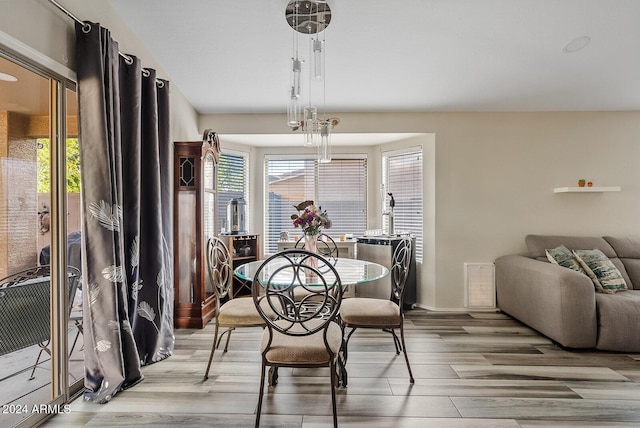 dining room with light hardwood / wood-style flooring