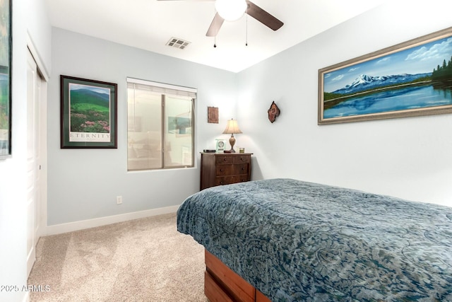 bedroom featuring visible vents, baseboards, a ceiling fan, and carpet flooring