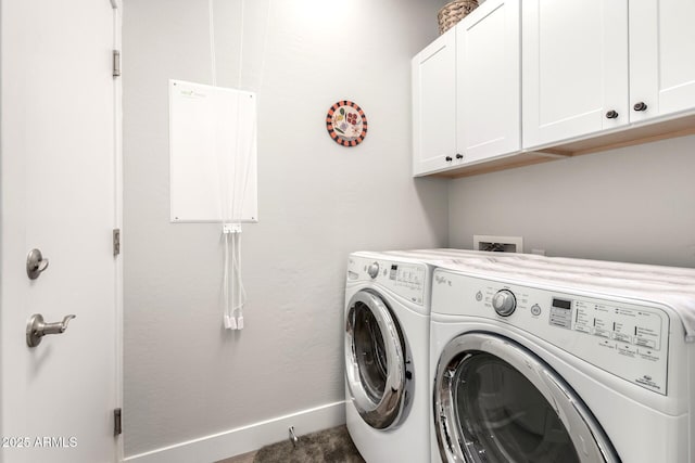 laundry room with baseboards, cabinet space, and washing machine and dryer