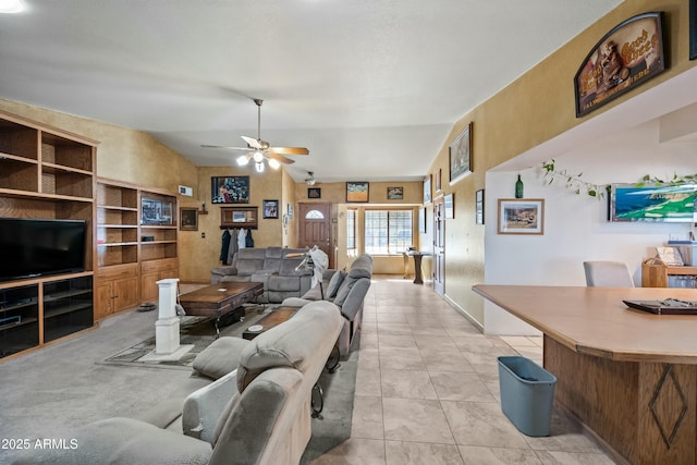 tiled living room featuring vaulted ceiling, built in features, and ceiling fan