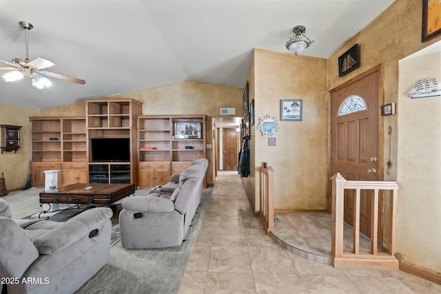 living room featuring built in features, vaulted ceiling, ceiling fan, and light tile patterned flooring