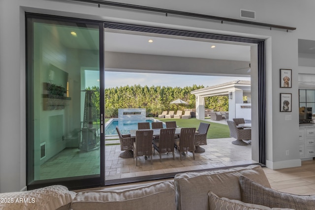 doorway to outside featuring visible vents