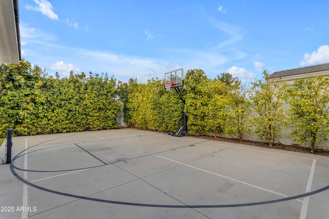 view of sport court with basketball hoop