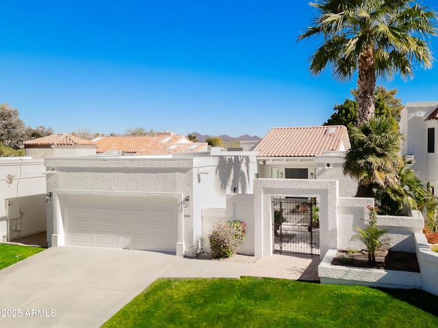 mediterranean / spanish home with a garage