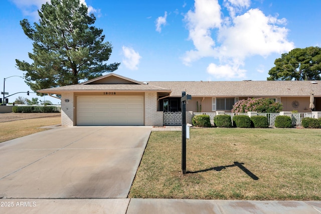 ranch-style home with a front yard, driveway, roof with shingles, a garage, and brick siding