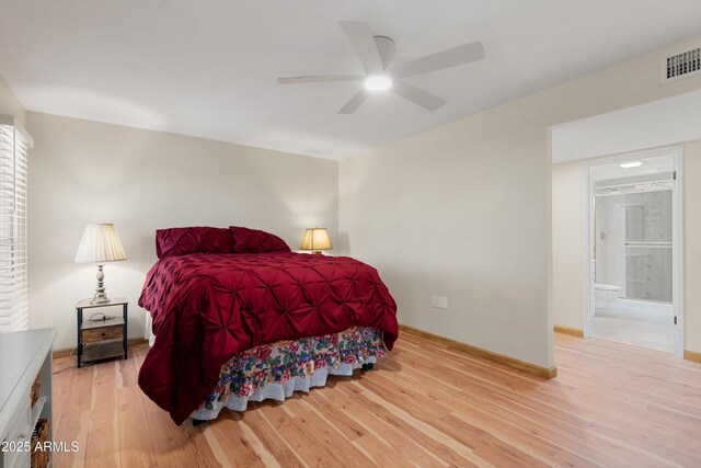 bedroom with light wood-type flooring, visible vents, ensuite bath, baseboards, and ceiling fan