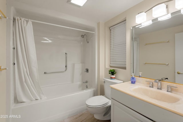 full bath featuring vanity, toilet, and shower / bath combo with shower curtain