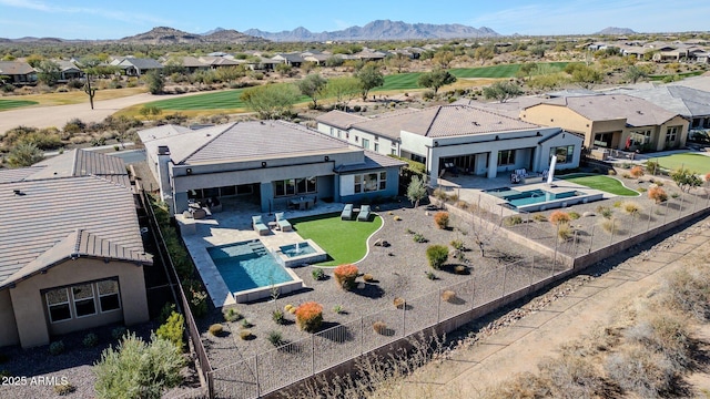 birds eye view of property featuring a mountain view