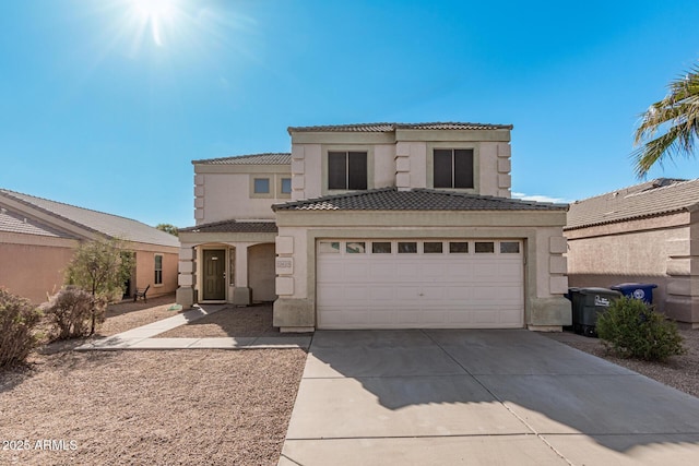 mediterranean / spanish-style home with a garage