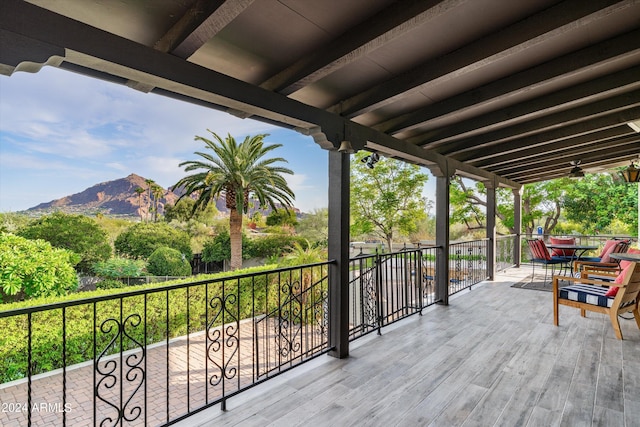 wooden deck with a mountain view