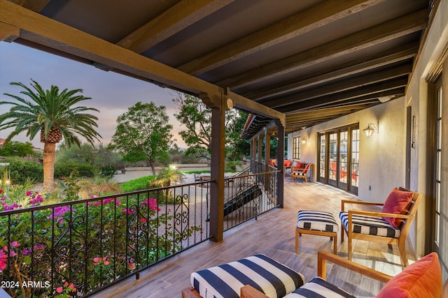 view of balcony at dusk