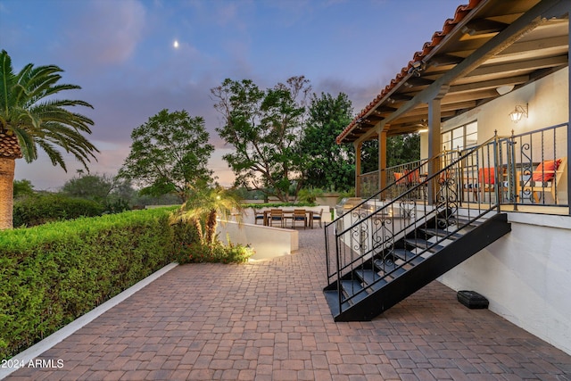 view of patio terrace at dusk