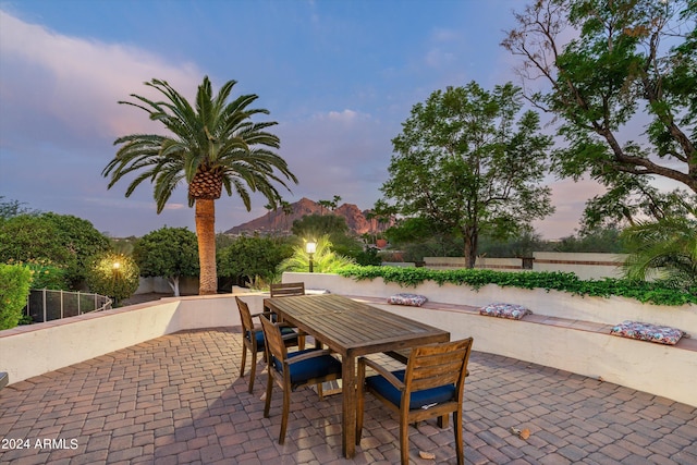 view of patio terrace at dusk