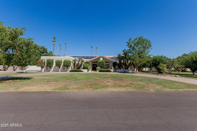 5237 N 106th Ave, Glendale, AZ 85307 - view of front of home with solar panels, curved driveway, and a front lawn