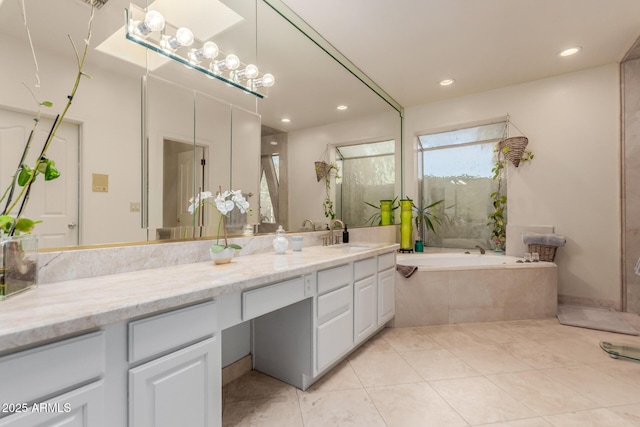5237 N 106th Ave, Glendale, AZ 85307 - bathroom with vanity, a garden tub, tile patterned flooring, recessed lighting, and a shower