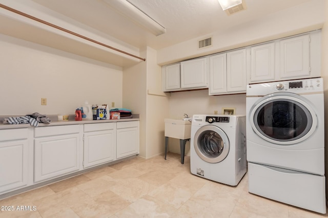 5237 N 106th Ave, Glendale, AZ 85307 - laundry room with separate washer and dryer and cabinet space