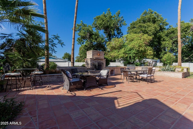 5237 N 106th Ave, Glendale, AZ 85307 - view of patio featuring outdoor dining area, an outdoor stone fireplace, and grilling area