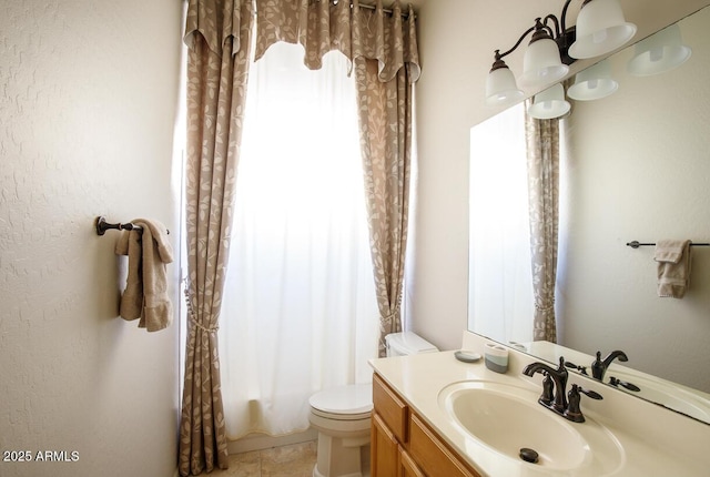 bathroom with toilet, shower / bath combo, and vanity