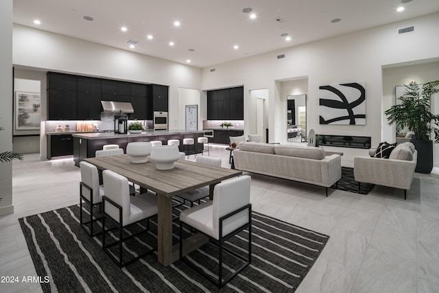 dining area featuring a high ceiling