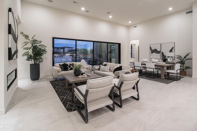 living room with a towering ceiling