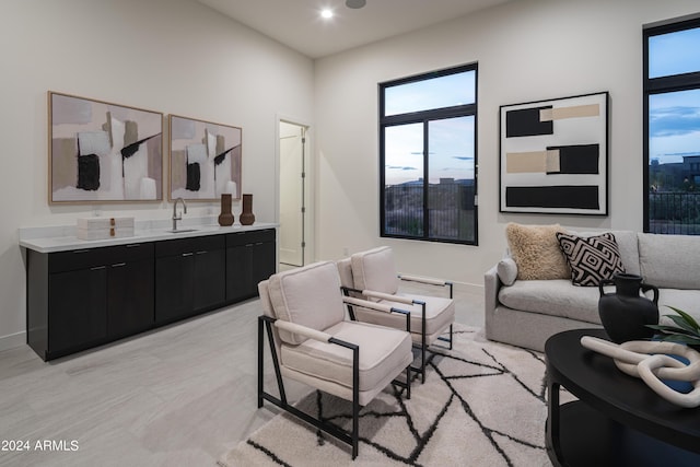 living room with sink and a healthy amount of sunlight