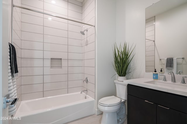 full bathroom with vanity, tiled shower / bath combo, and toilet