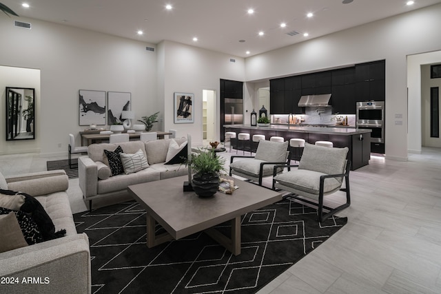 living room with a high ceiling