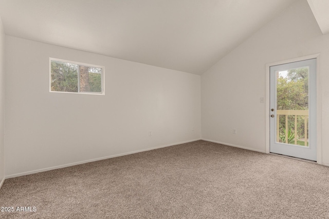 additional living space with carpet floors, vaulted ceiling, and baseboards