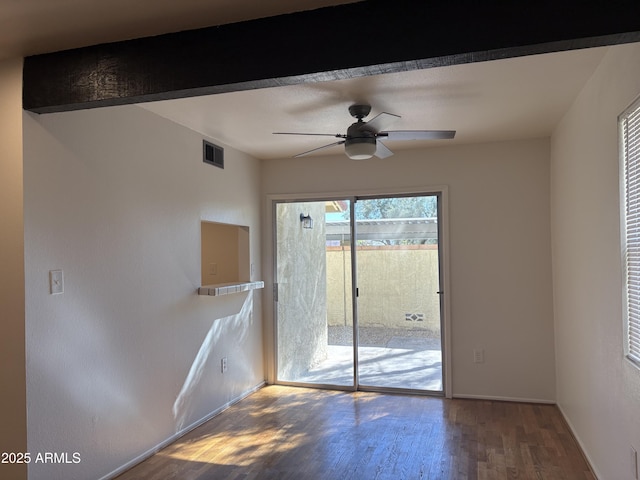 unfurnished room with hardwood / wood-style floors and ceiling fan