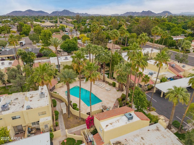 bird's eye view of a mountainous background and a pool