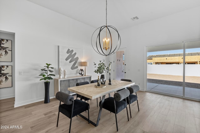 dining room featuring a chandelier and light hardwood / wood-style floors