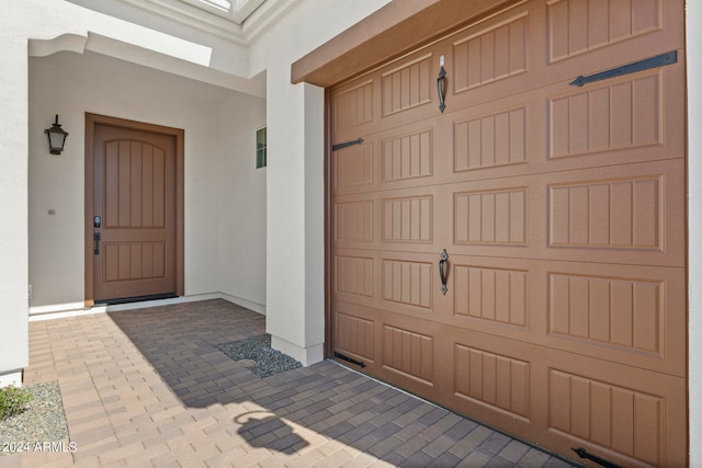 property entrance with a garage