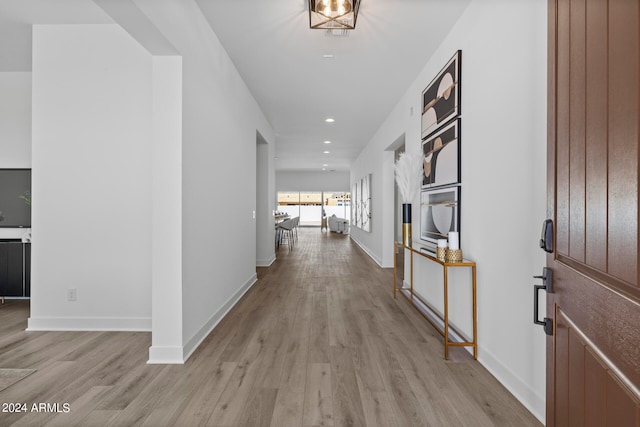 corridor featuring light hardwood / wood-style floors