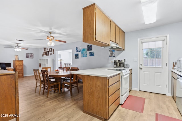 kitchen featuring white range with electric stovetop, stainless steel dishwasher, ceiling fan, kitchen peninsula, and light wood-type flooring