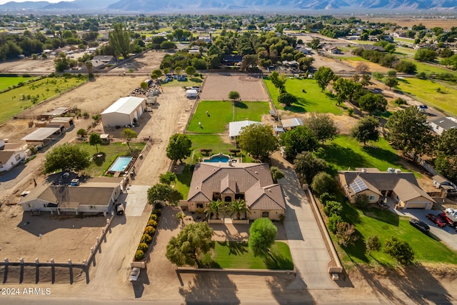 birds eye view of property with a mountain view