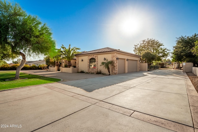 mediterranean / spanish house featuring a garage