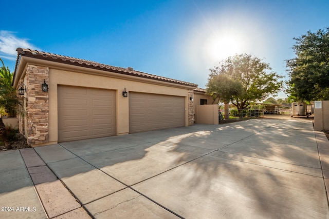 view of property exterior featuring a garage