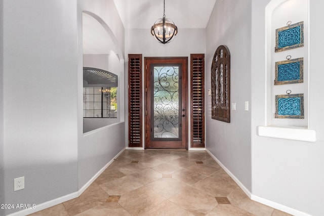 entrance foyer featuring a chandelier