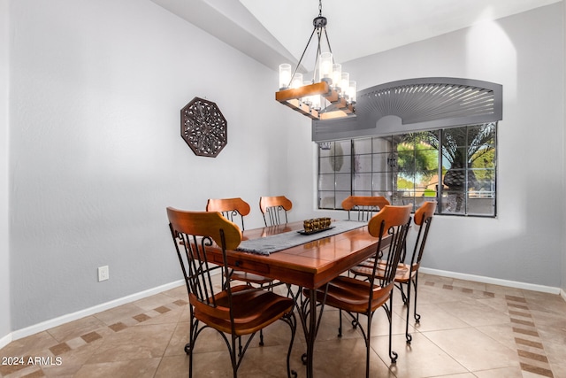 dining area featuring light tile patterned flooring, vaulted ceiling, and an inviting chandelier