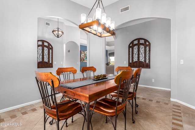 dining space featuring an inviting chandelier