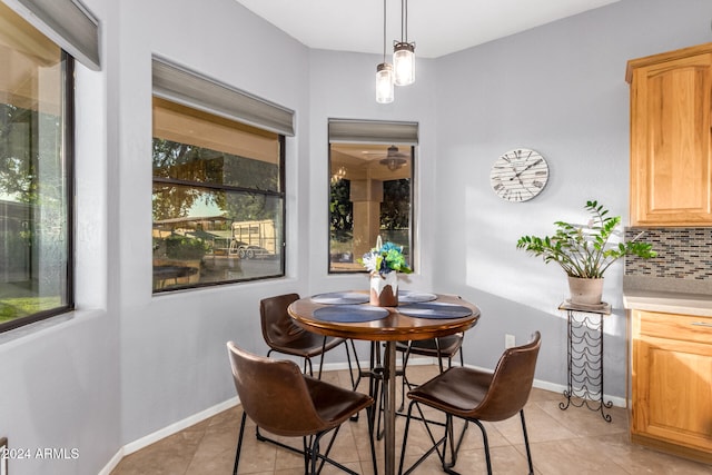 dining space featuring light tile patterned floors