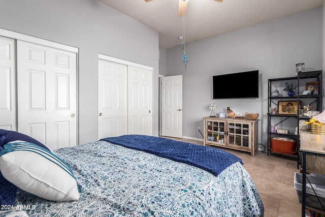 bedroom featuring ceiling fan and two closets