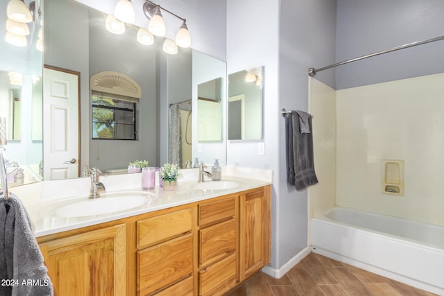 bathroom featuring vanity, shower / tub combo, and hardwood / wood-style flooring