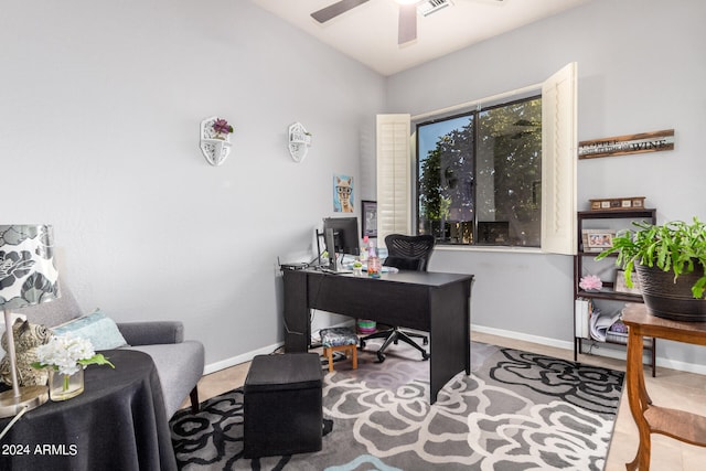 home office featuring ceiling fan and lofted ceiling